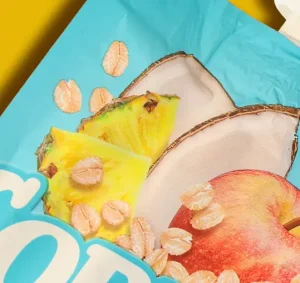 a close-up of a bag with pineapple, coconut and apple.